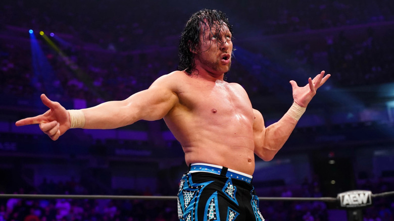 Kenny Omega posing during match against Bryan Danielson