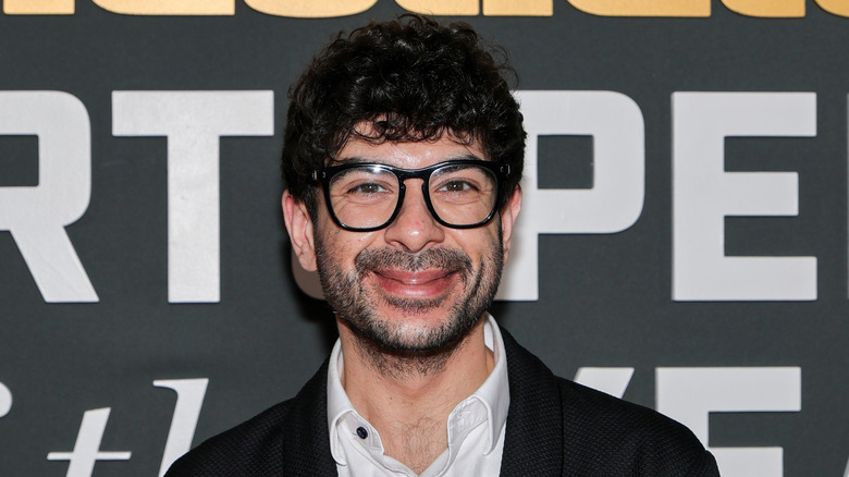Tony Khan having a good time at a Sports Illustrated event