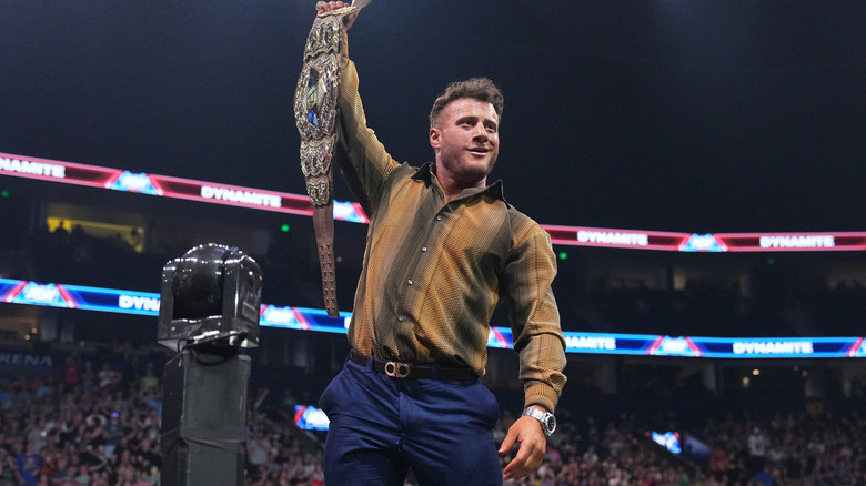 MJF smirks as he holds up his title belt