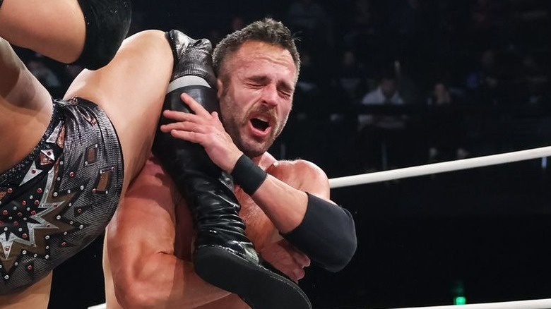 Roderick Strong takes a knee to the face