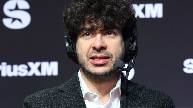 Tony Khan wearing a headset