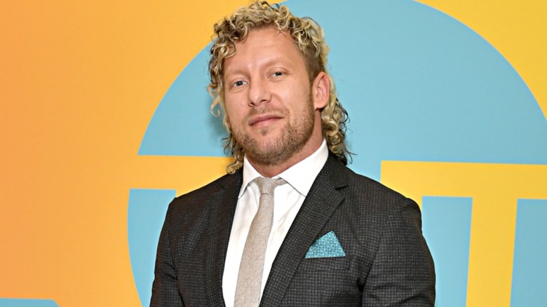 AEW's Kenny Omega wearing a suit