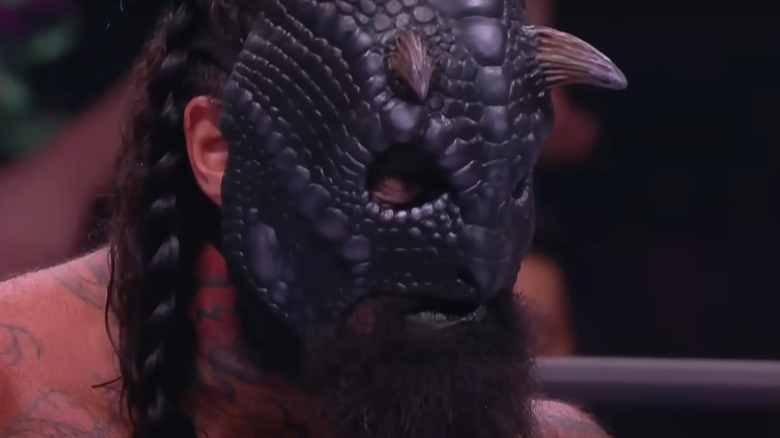 Luchasaurus wearing black variation of his mask