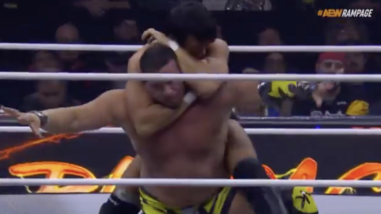 Shibata with a sleeper locked on Matthews