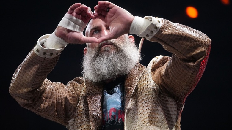 Tommaso Ciampa makes a heart with his hands on "AEW Collision"