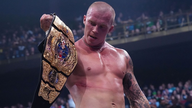 Kyle Fletcher looking at the AEW International Championship