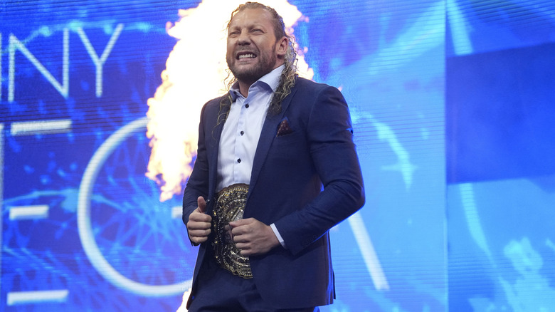 Kenny Omega on AEW Dynamite with pyro in the background