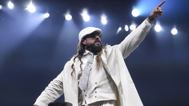 Andrade stands on the ropes and points, posing after a beatdown of the Don Callis family on the July 22, 2026 edition of "AEW Dynamite."