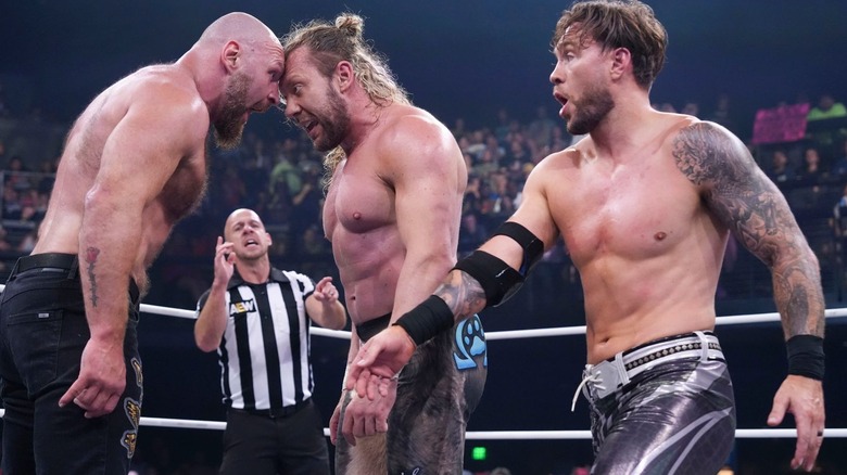Jon Moxley and Kenny Omega go nose to nose as Will Ospreay looks on on "AEW Dynamite"