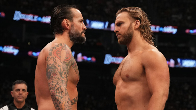 CM Punk staring down Adam Page