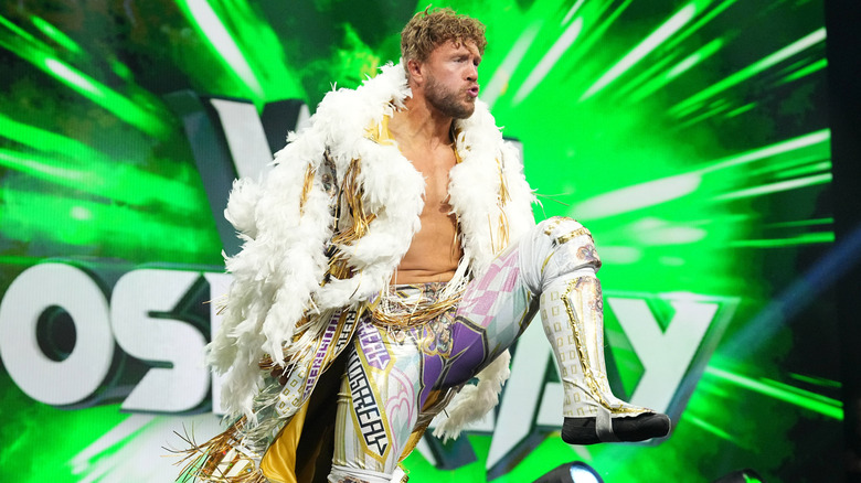 Will Ospreay poses on the stage during his entrance before a match on "AEW Dynamite."