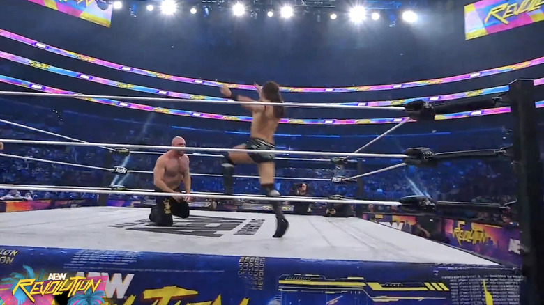 Takeshita about to land a running knee on Moxley