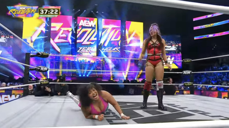 Kriss standing over Nightingale