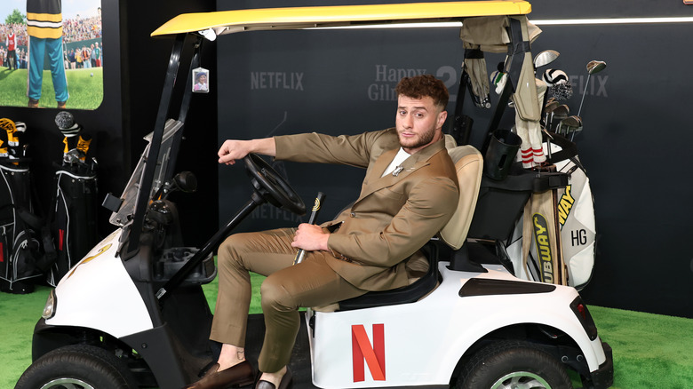 MJF poses with a golf cart
