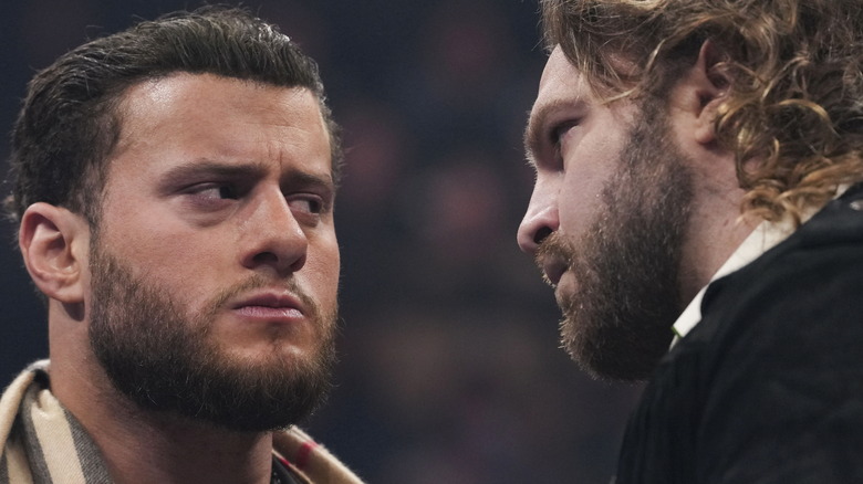 AEW World Champion MJF stares down his challenger for Revolution, "Hangman" Adam Page during an in-ring promo segment on "AEW Dynamite" where the chose a stipulation for their match.