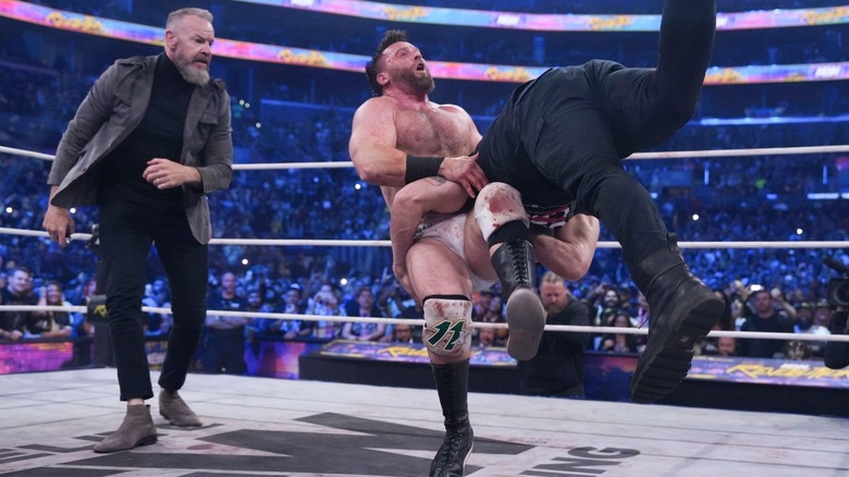 Adam Copeland spears Cash Wheeler as Christian Cage watches on