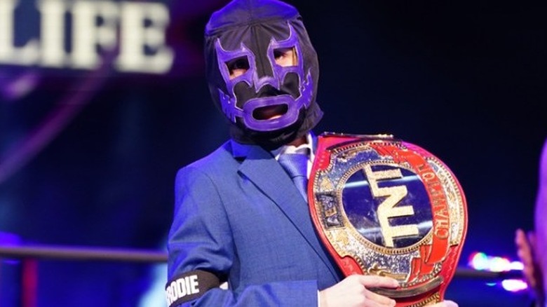 Brodie Lee Jr. (Negative One) poses with his late father's TNT Championship title