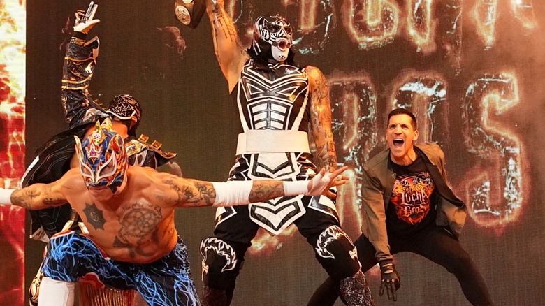 The Lucha Bros. and Bandido make an entrance flanked by Alex Abrahantes