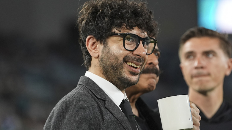 AEW President Tony Khan with his father Shahid Khan in the background