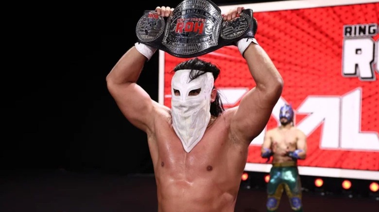 Bandido holds up the ROH World Championship after a victory on ROH programming.