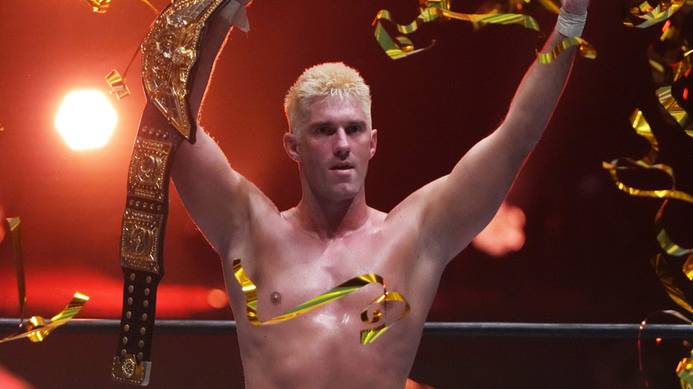 Zack Sabre Jr. celebrates with the IWGP World Championship