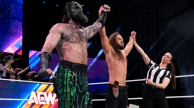 Jurassic Express celebrating a win on AEW Dynamite