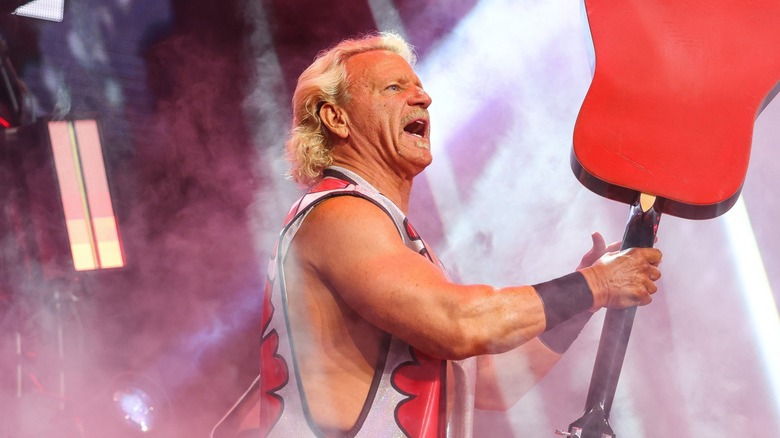 Jeff Jarrett with a guitar