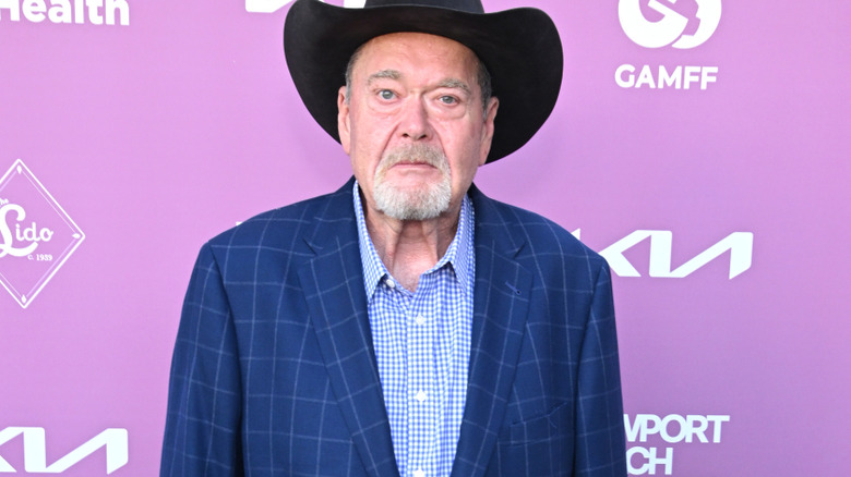 Jim Ross wearing a black cowboy hat