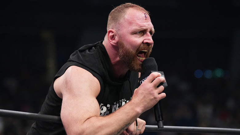 Jon Moxley talking into microphone