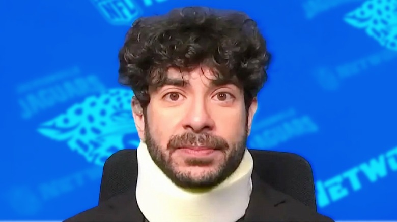 Tony Khan wearing neck brace