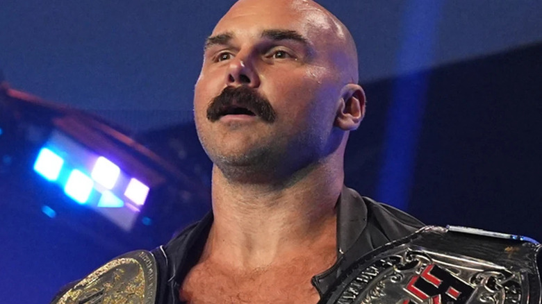 Dax Harwood walking with championships