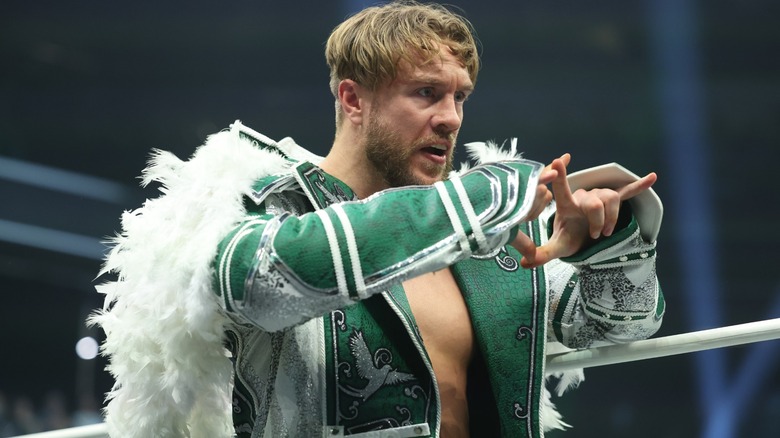 Will Ospreay performing his signature taunt in ring during an episode of 