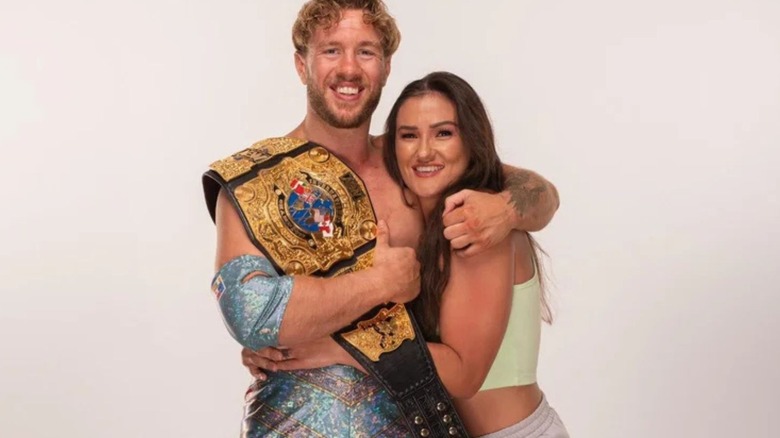 Alex Windsor hugs fiance, and then-AEW International Champion, Will Ospreay in a photo posted to the company's social media.