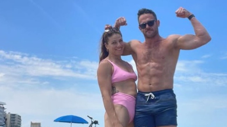 Roderick Strong flexes alongside wife Marina Shafir in a beach photo posted to his Instagram.