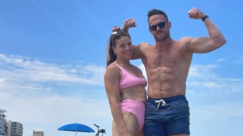 Roderick Strong flexes alongside wife Marina Shafir in a beach photo posted to his Instagram.