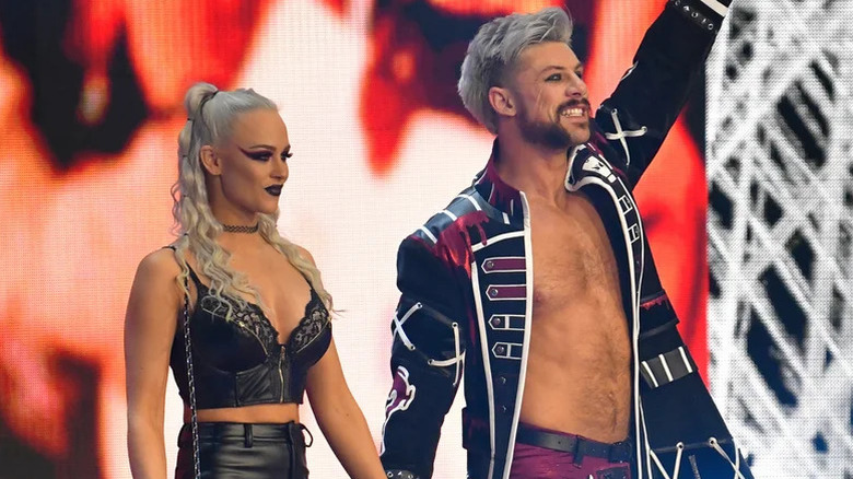 Kip Sabian and Penelope Ford make their way to the ring during an episode of AEW programming.