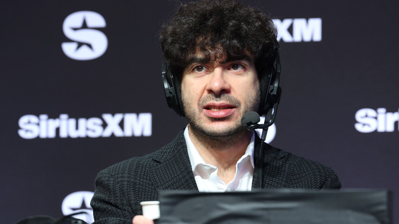 Tony Khan in front of a Sirius XM banner