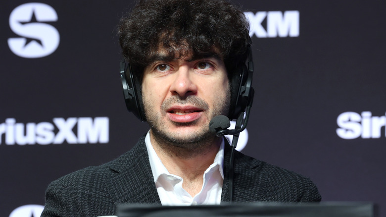 Tony Khan in front of a Sirius XM banner