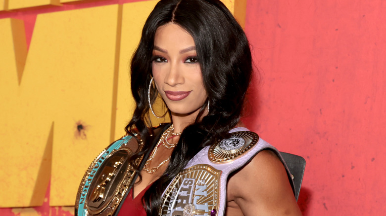Mercedes Mone wearing silver hoop earrings