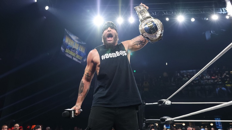 Mark Briscoe holds his TNT Championship aloft