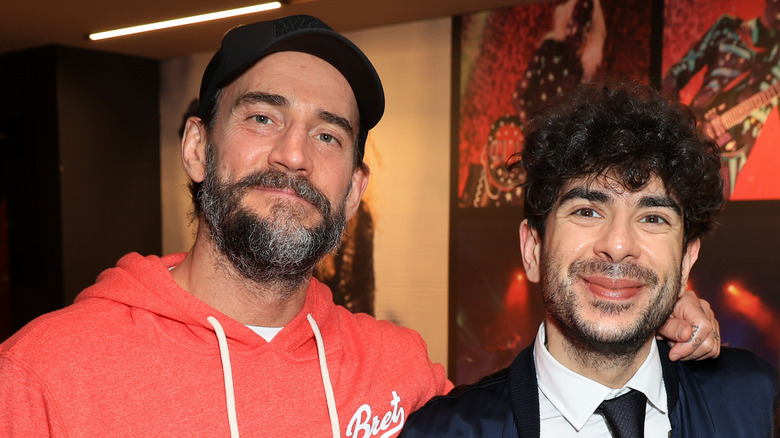 Tony Khan And CM Punk Pose Together At An Event