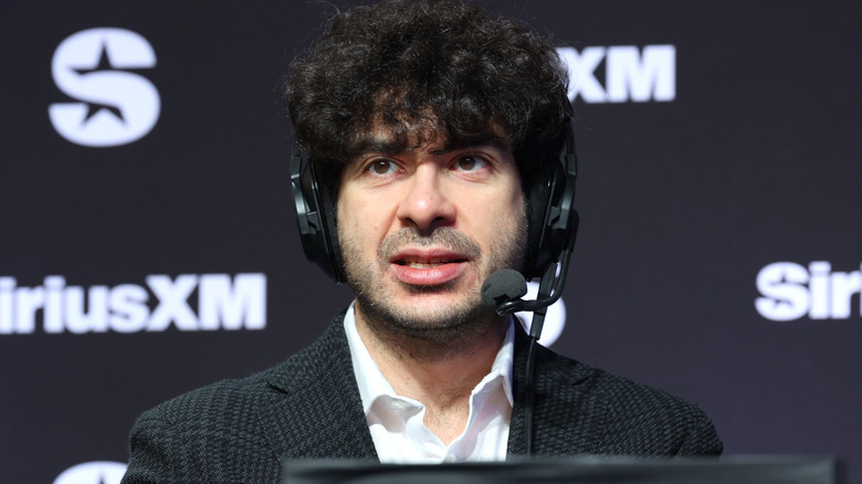 Tony Khan wearing a headset