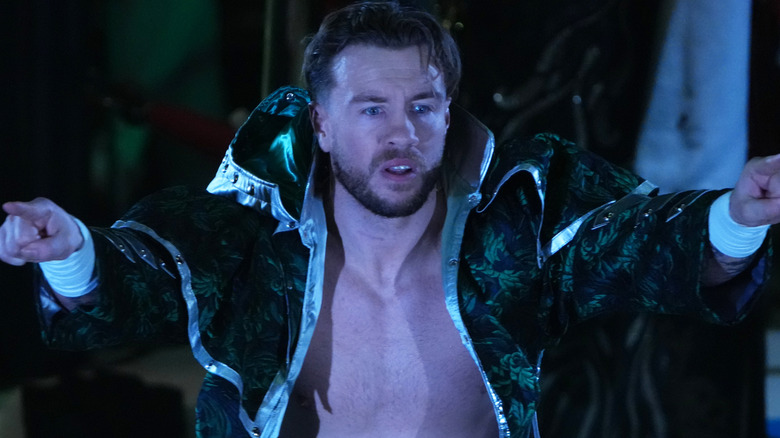 Will Ospreay pointing his arms