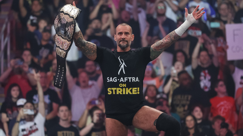 CM Punk posing on "AEW Collision"