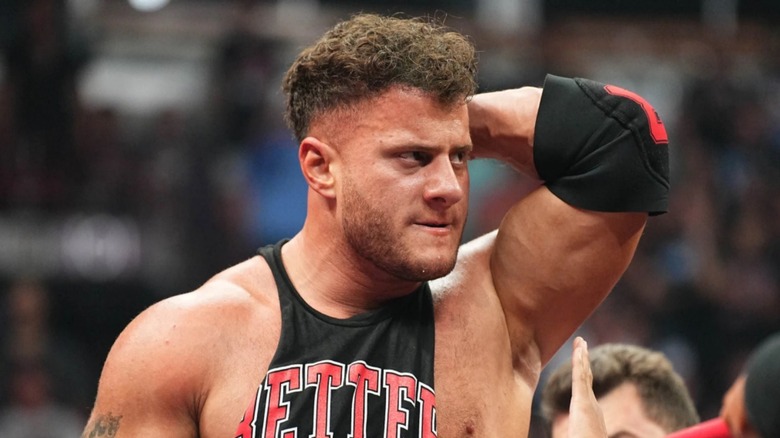 MJF grabbing at his head as it hurts