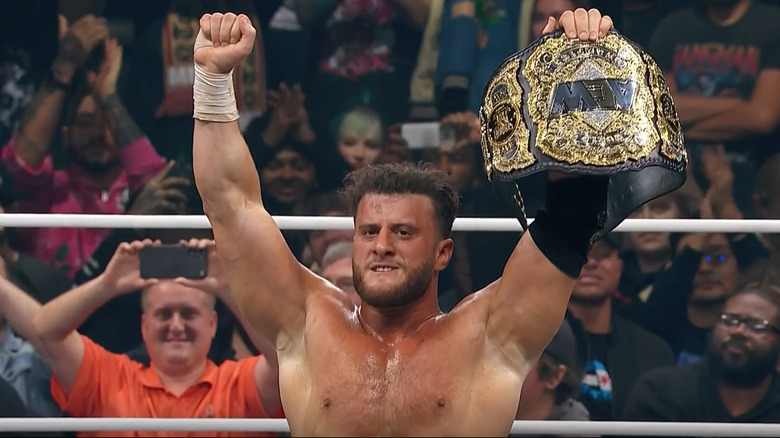 MJF holding up the AEW World Championship at Worlds End 2025