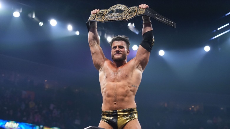 MJF holds up the AEW World Title triumphantly