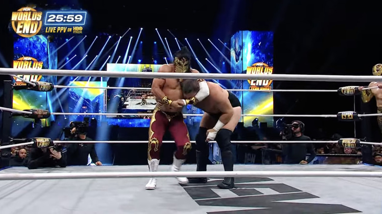 Bandido with a side headlock cinched in on Bandido