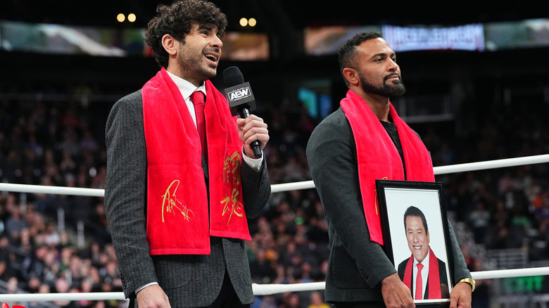 Tony Khan ecstatic after being given one of Antonio Inoki's scarves