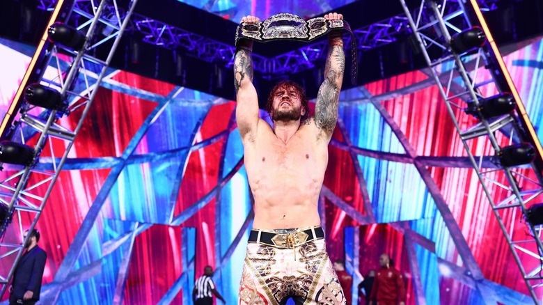 Will Ospreay holding the AEW Men's World Championship over his head
